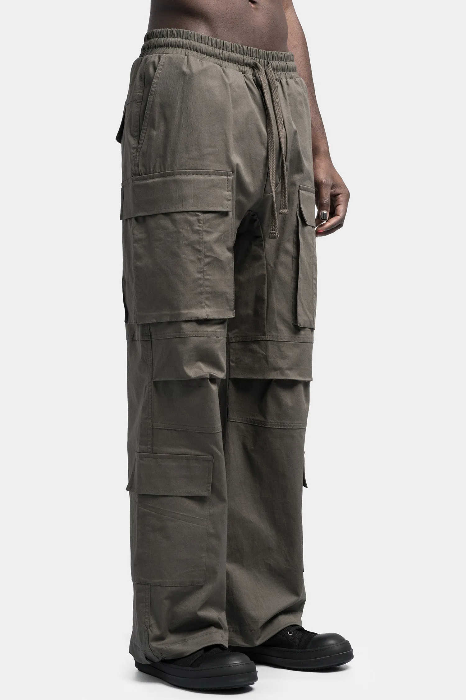 Oversized cargo trousers in a vibrant shade of Ivy green.