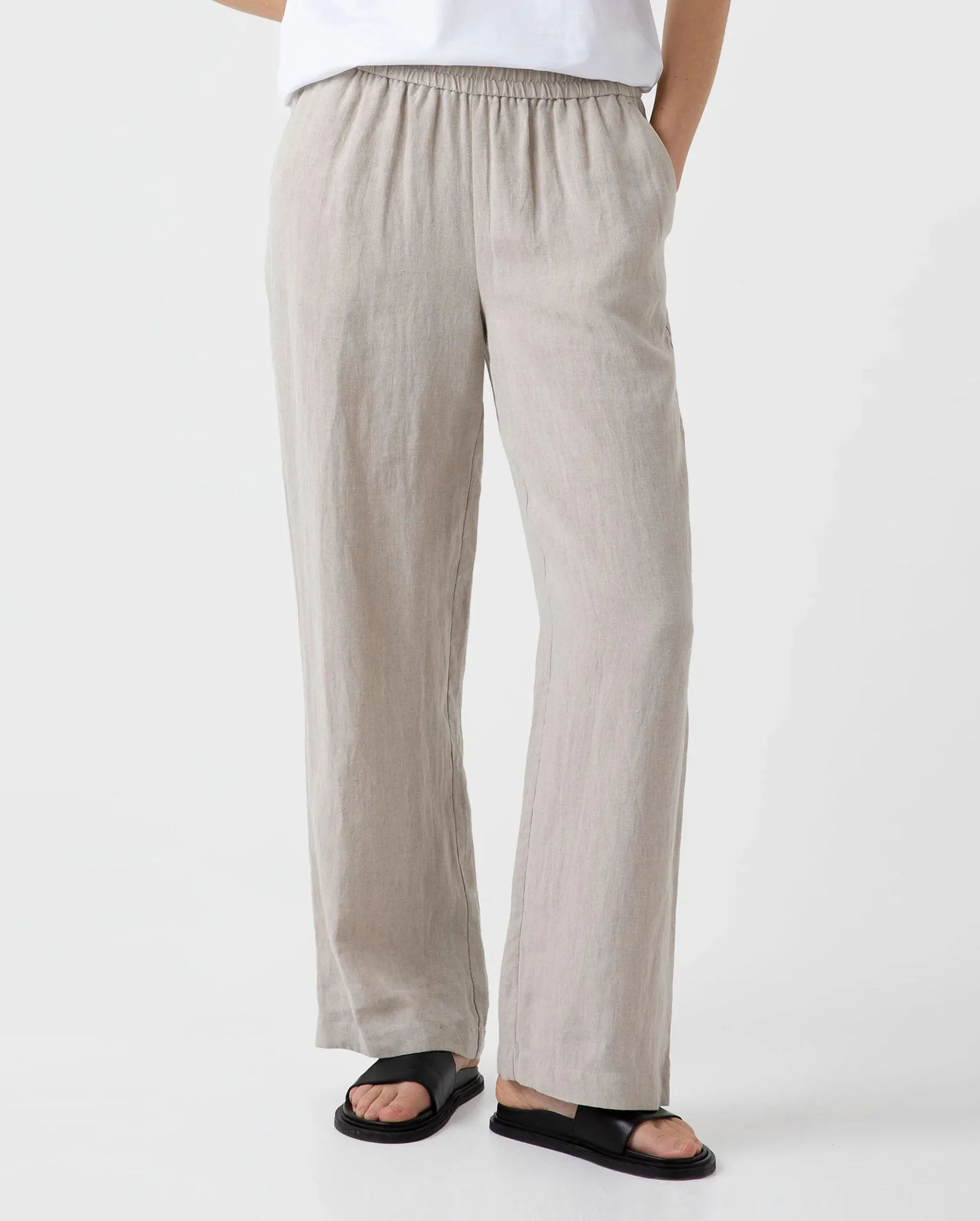 Wide leg trousers with drawstring in light sand color.