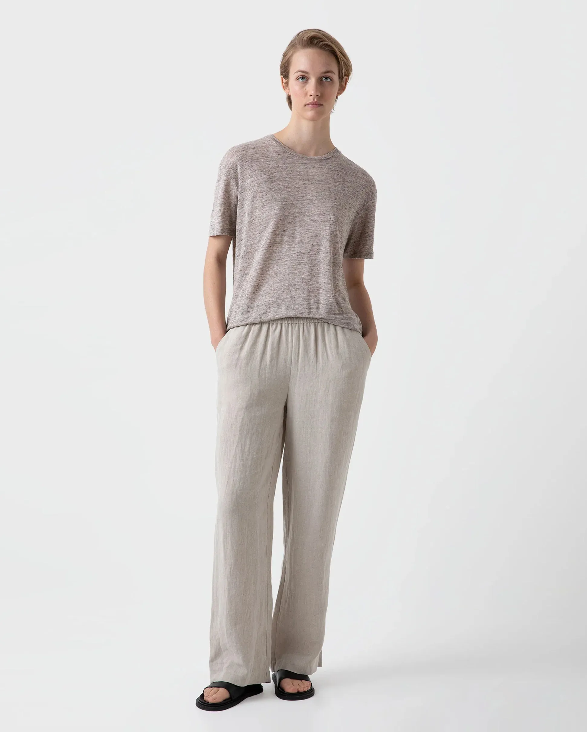 Wide leg trousers with drawstring in light sand color.