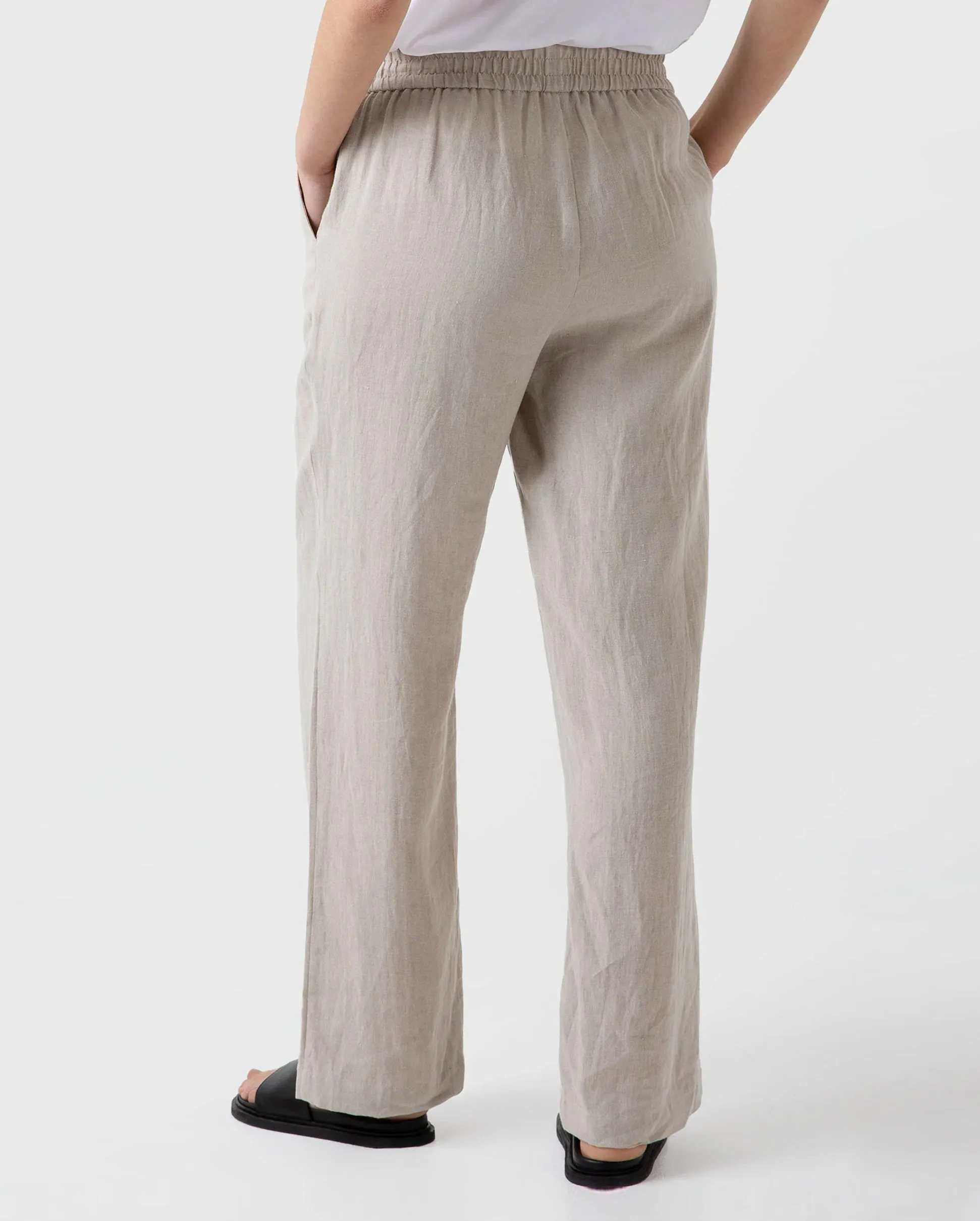 Wide leg trousers with drawstring in light sand color.